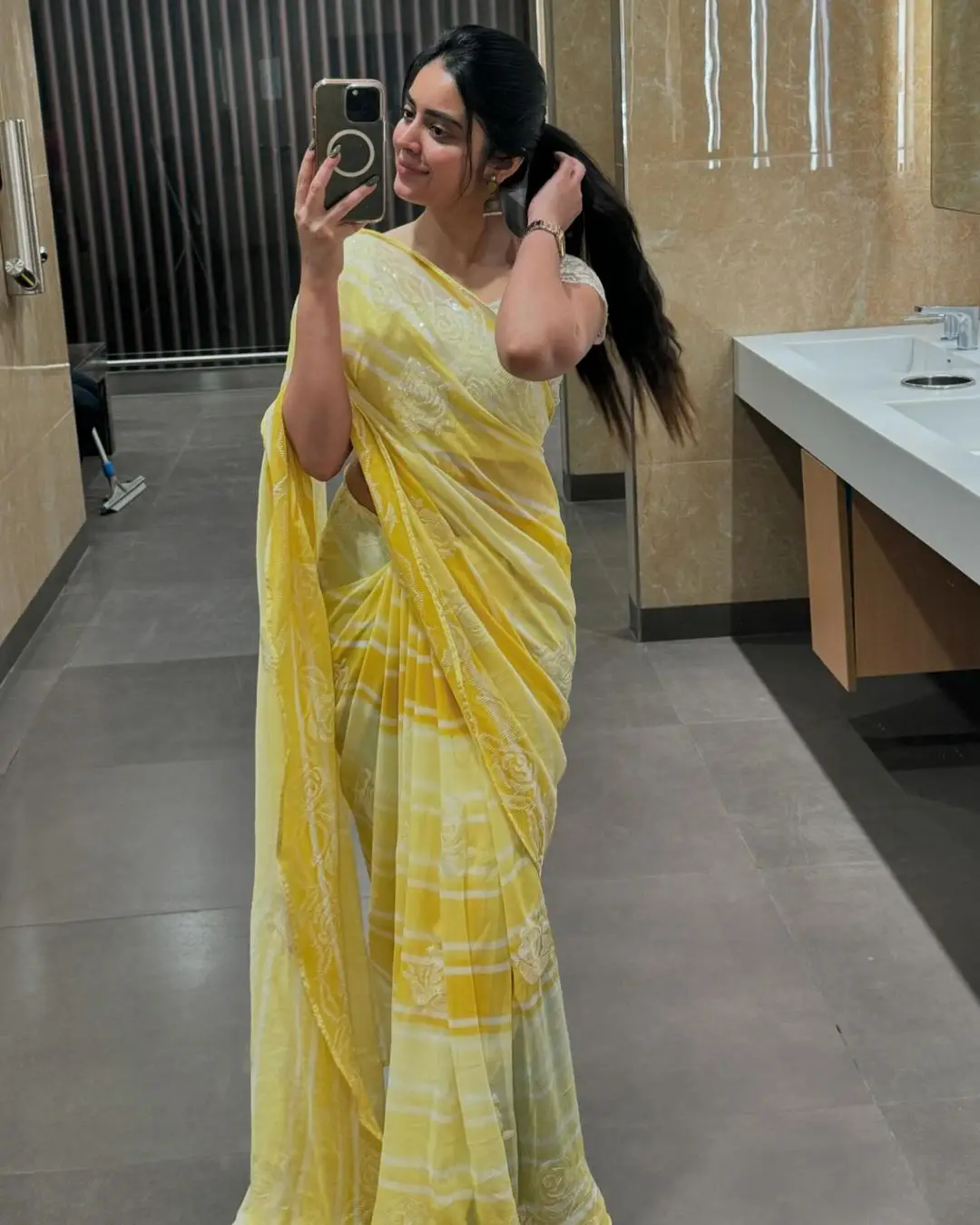 Kushita Kallapu In Traditional Yellow Saree White Blouse